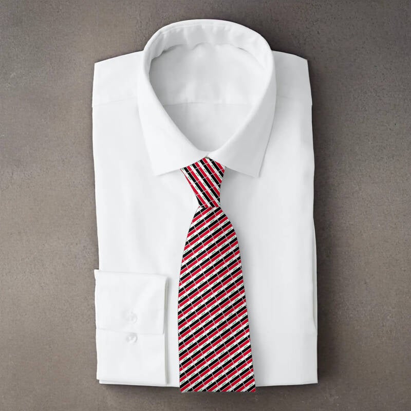 Iraq flag necktie on folded white shirt