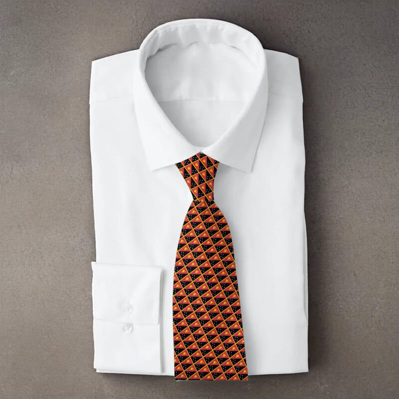 Papua New Guinea flag necktie on folded white shirt