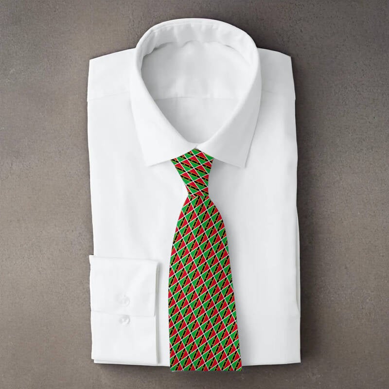 Saint Kitts and Nevis flag necktie on folded white shirt