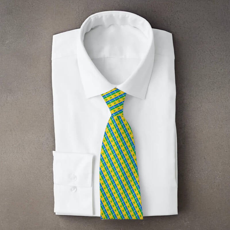 Saint Vincent and the Grenadines flag necktie on folded white shirt