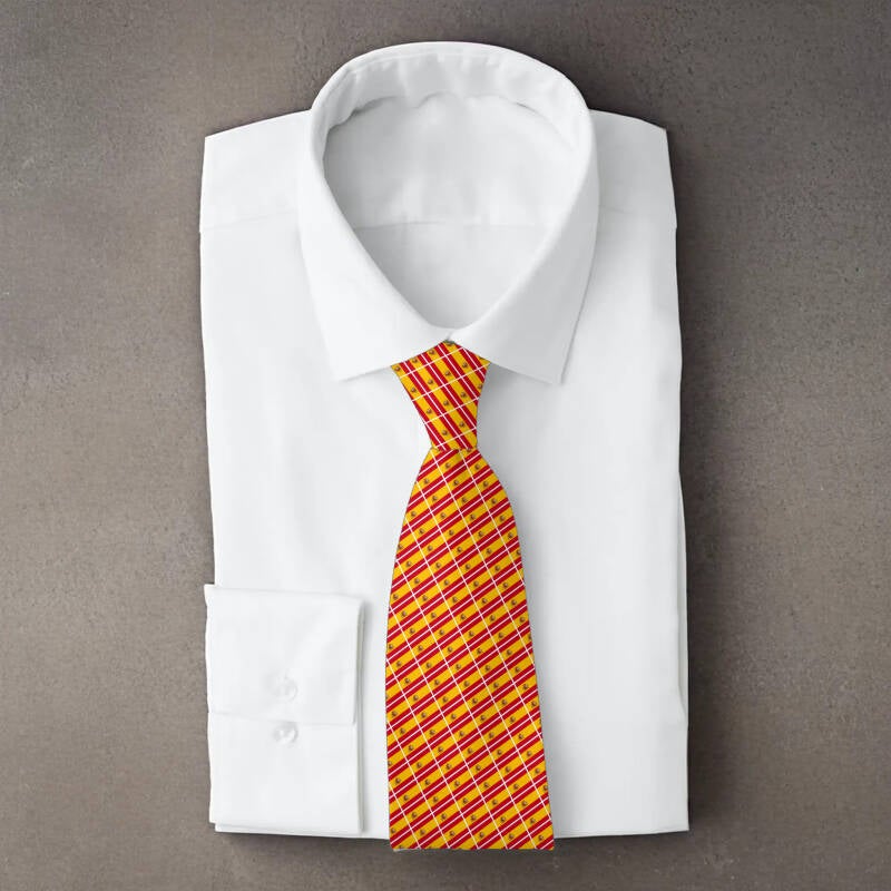 Spain flag necktie on folded white shirt