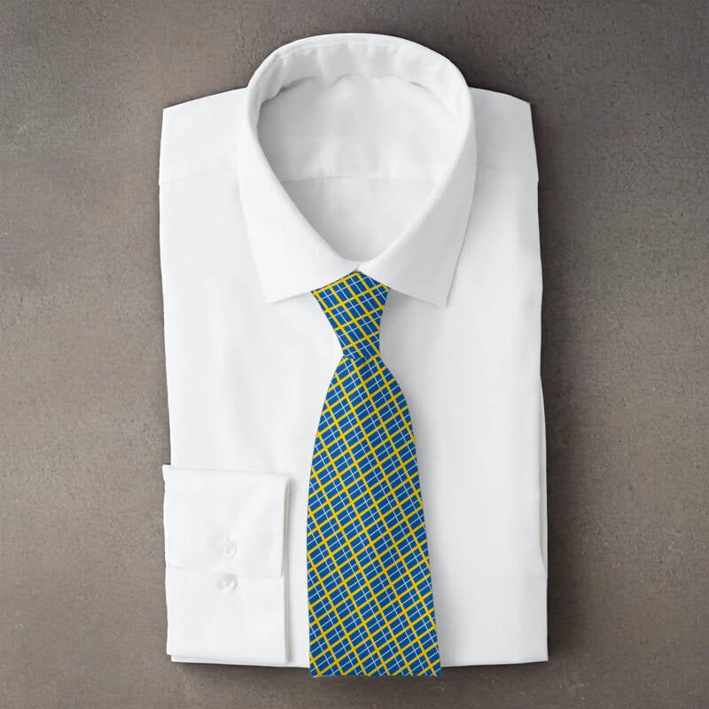 Sweden flag necktie on folded white shirt