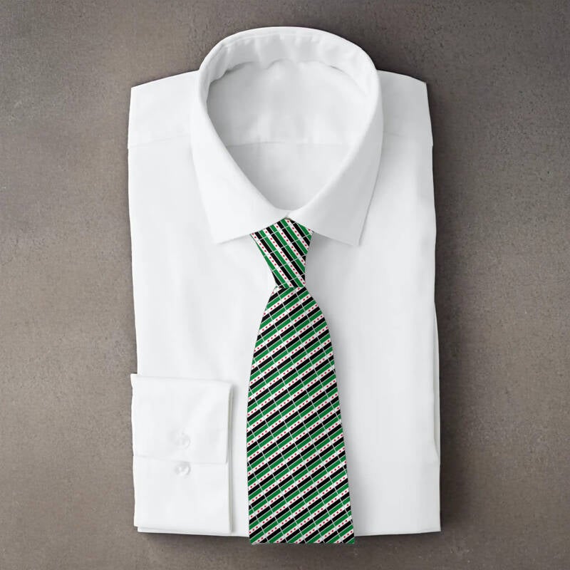 Syria flag necktie on folded white shirt