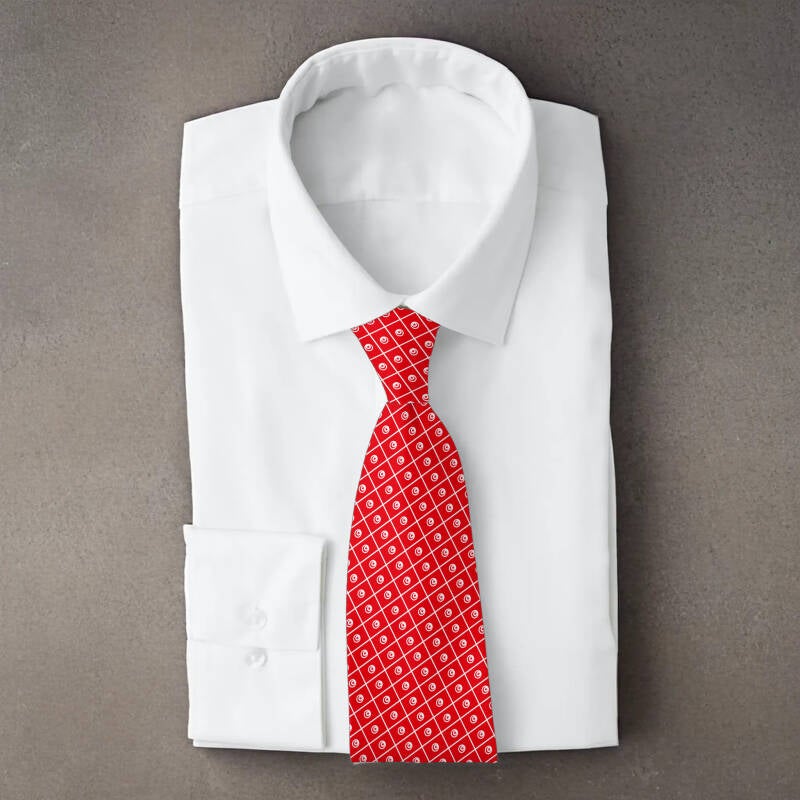 Tunisia flag necktie on folded white shirt