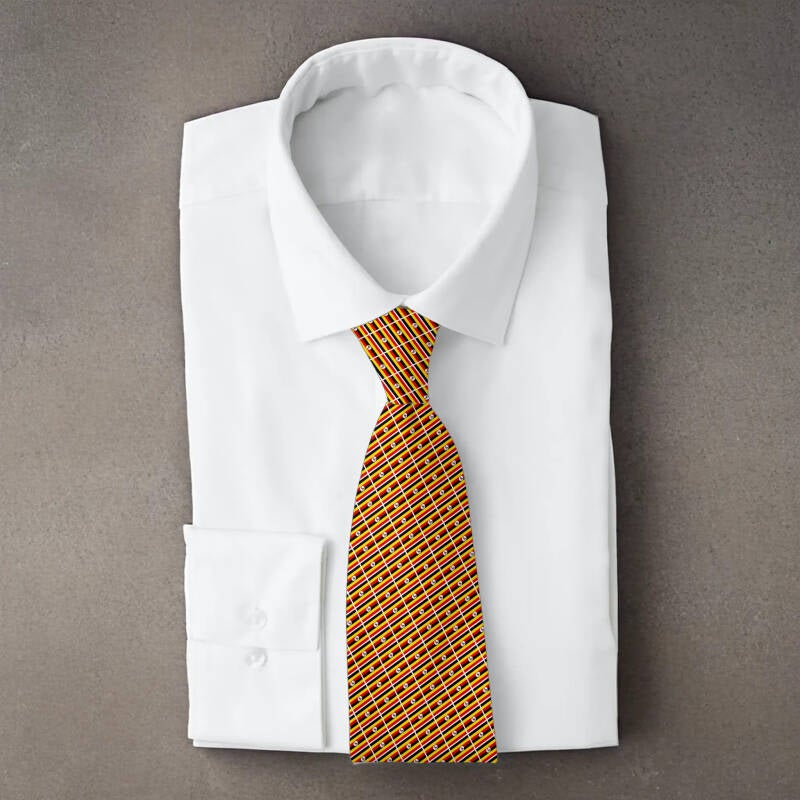 Uganda flag necktie on folded white shirt