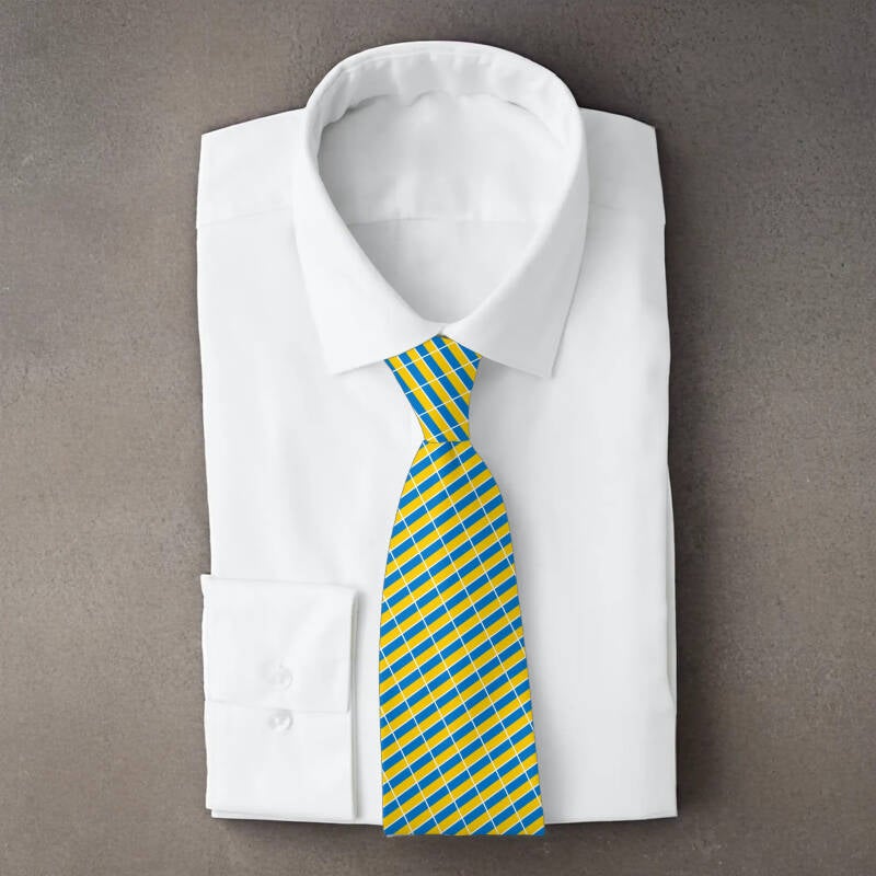Ukraine flag necktie on folded white shirt