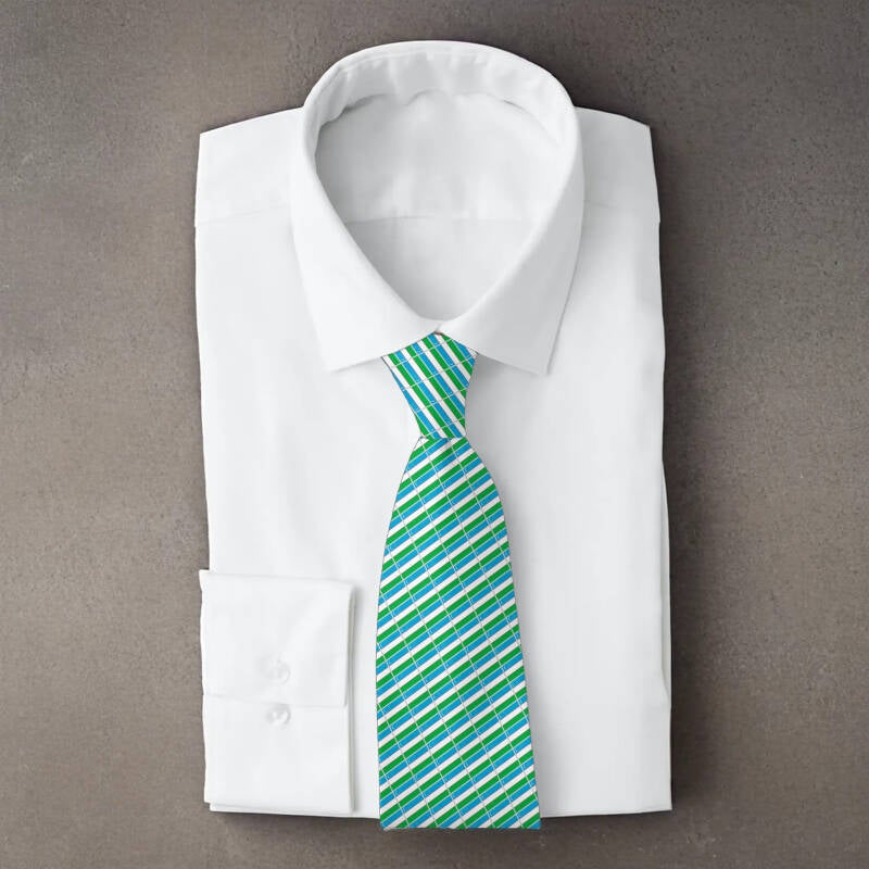 Uzbekistan flag necktie on folded white shirt