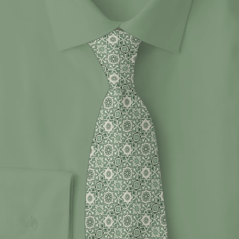 Sage green Arabesque geometric pattern necktie in sage and cream on folded sage color shirt
