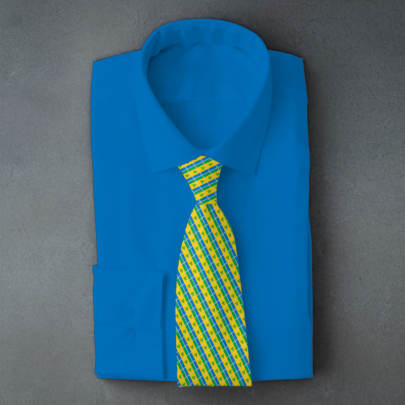 Saint Vincent and the Grenadines flag necktie on blue folded shirt