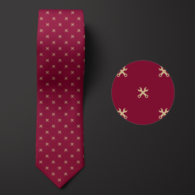 Burgundy necktie adorned with the pattern of gold wrenches.