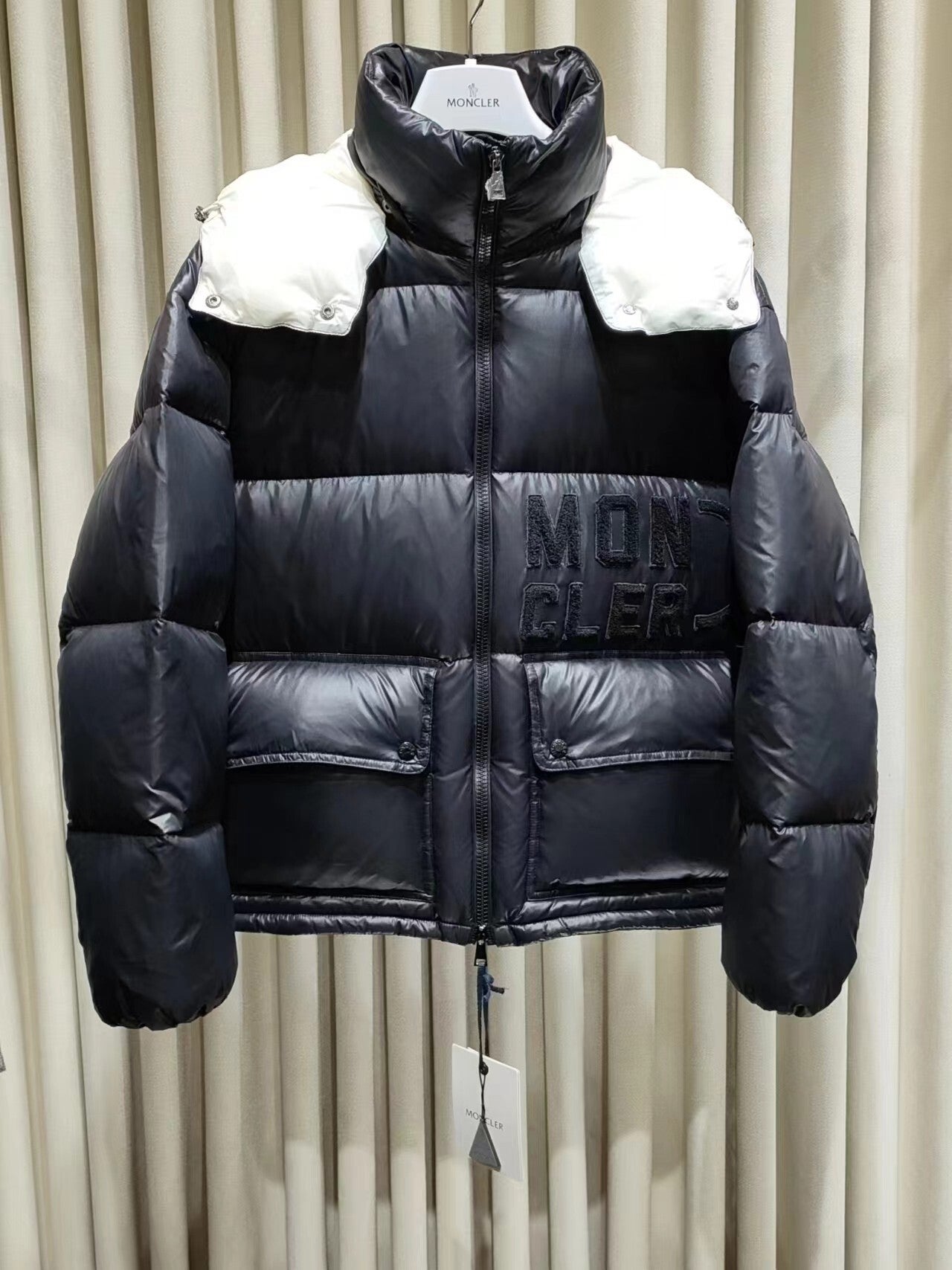 M//ncler cropped jacket in signature patented nylon.