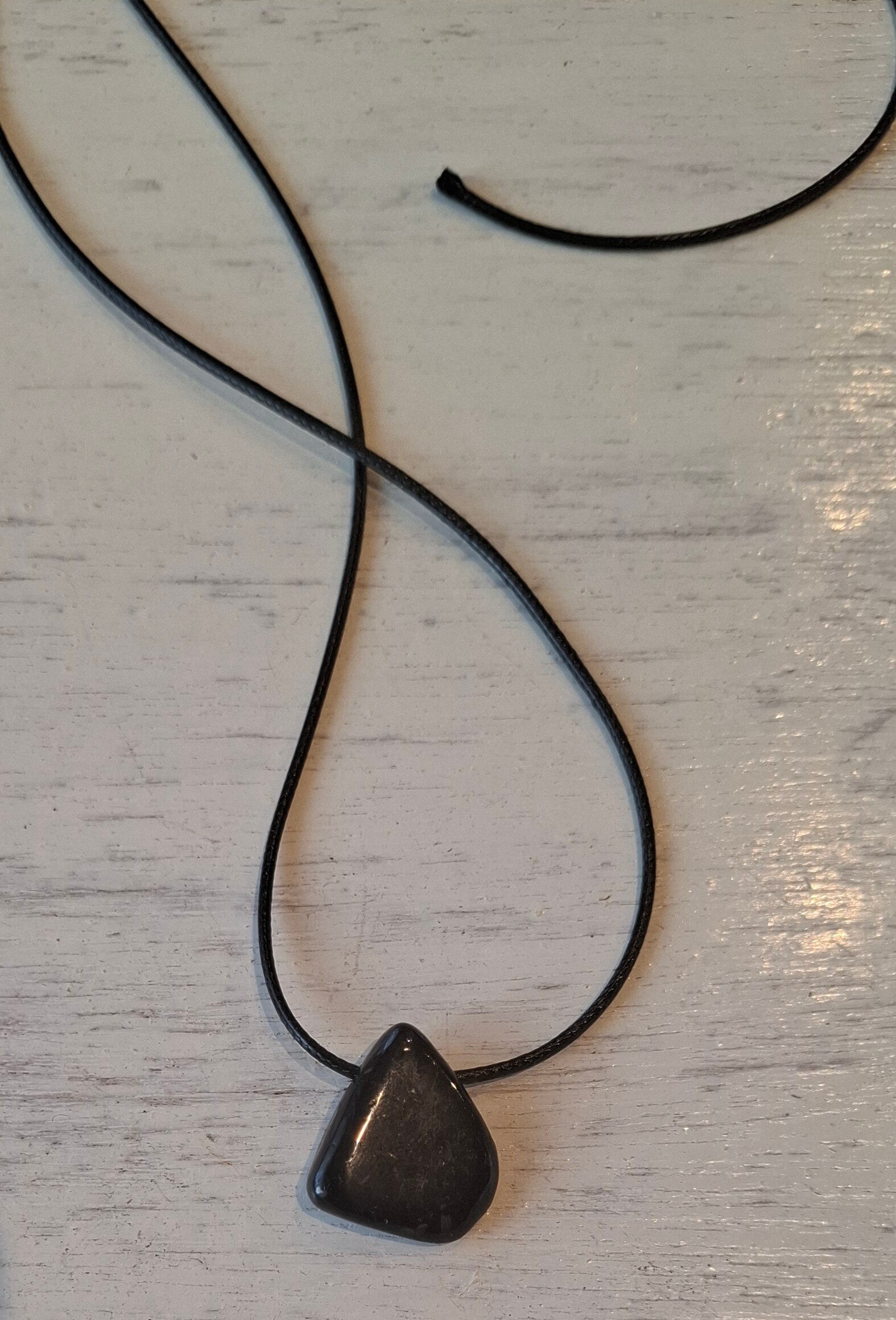 Nummiet doorboorde hanger