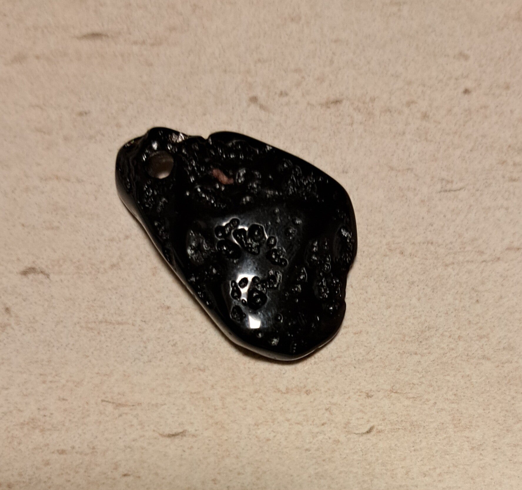 Tektiet doorboorde hanger