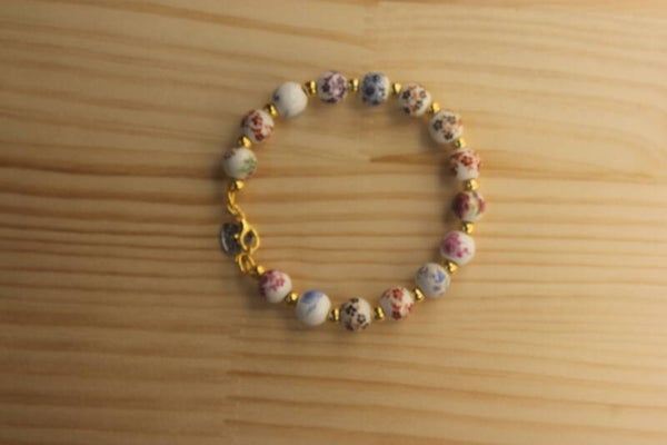 Ref. 26000039 - Pulsera PORCELANA DORADA