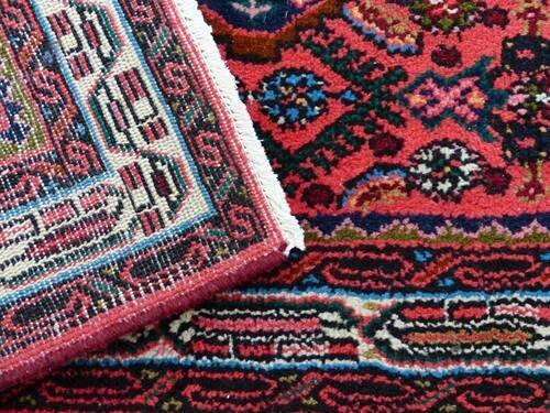 "Close-up image of a vibrant, intricately patterned area rug, showcasing the quality and attention to detail provided by Tegridy Carpets' professional area rug cleaning services."
