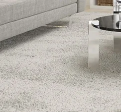 "A clean and plush carpet in a modern living room, illustrating how Tegridy Carpets' deep cleaning service restores the carpet's original beauty and freshness."