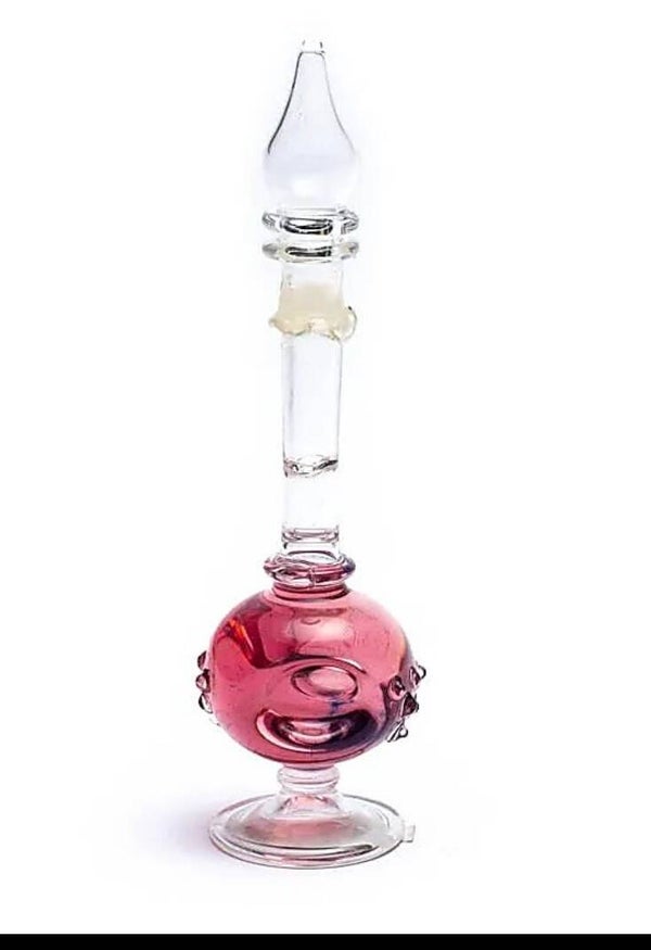 Rozen olie in mondgeblazen flesje