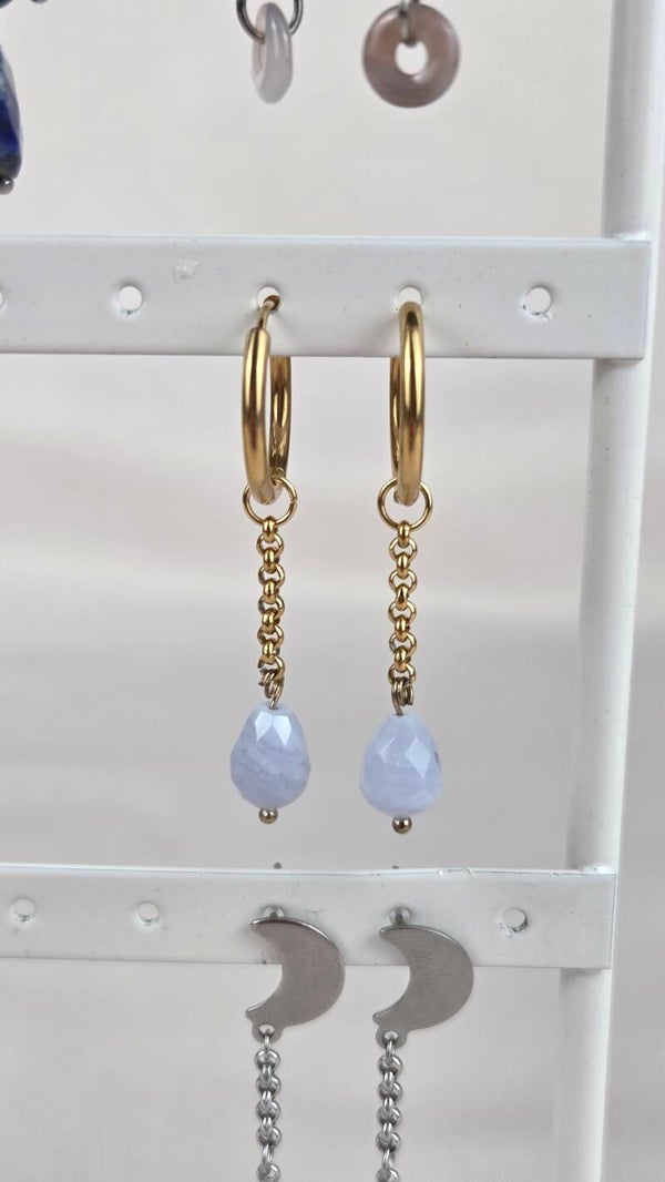 Dangling blue teardrop