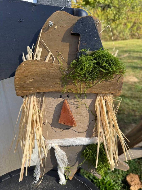 Wooden scarecrow head