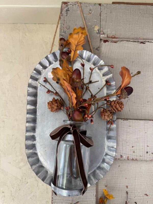 Tin wall hanging with glass jar and fall pick