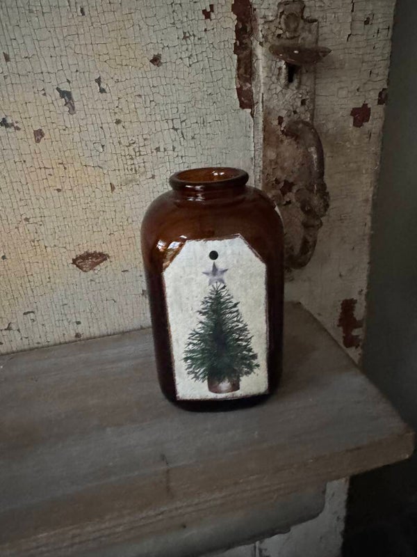 Amber glass bottle with tree