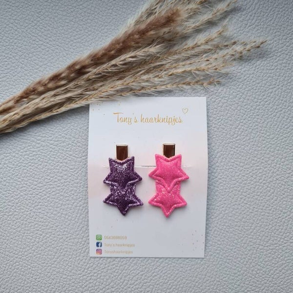 Alligatorclip met glittersterren lila/roze