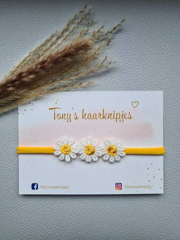 Nylon haarbandje met madeliefjes oranje