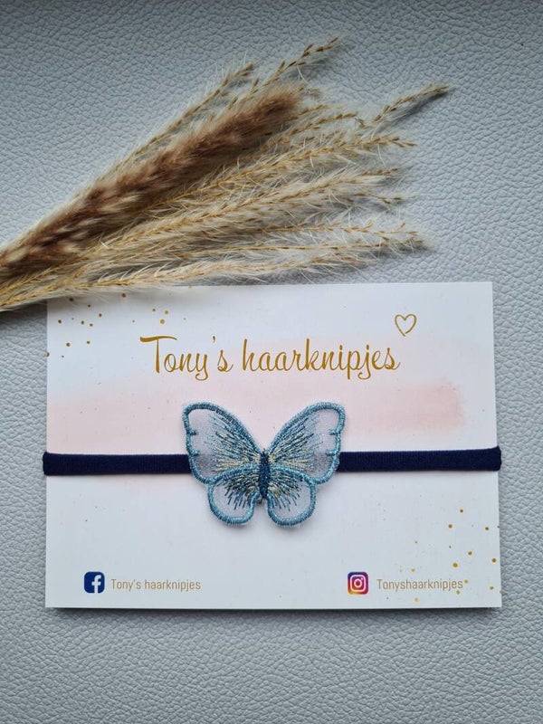 Nylon haarbandje met vlinder navy/blauw