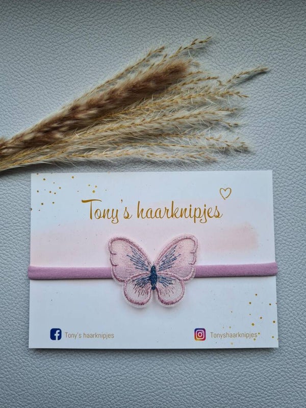 Nylon haarbandje met  vlinder lichtpaars