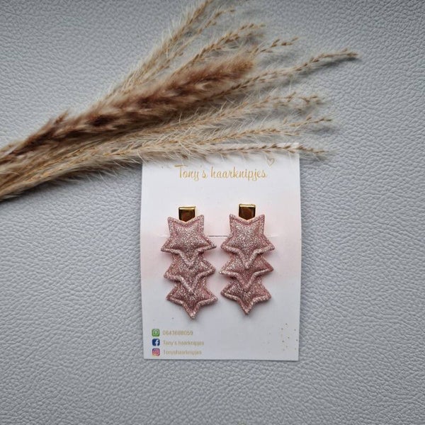 Alligatorclip met glittersterren roze
