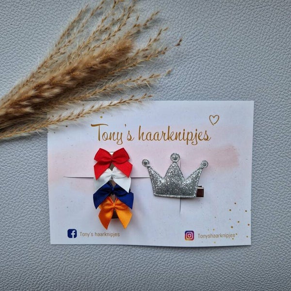 Kroontje zilver met alligatorclip 4,5cm rood/wit/blauw/oranje strikjes