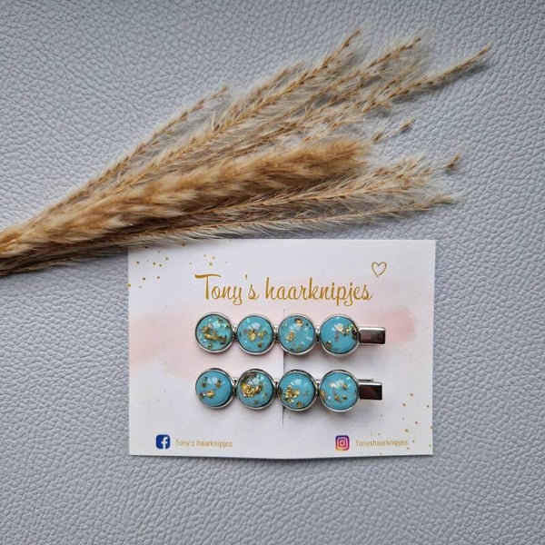 Alligatorclip met 4 stenen blauw/goud