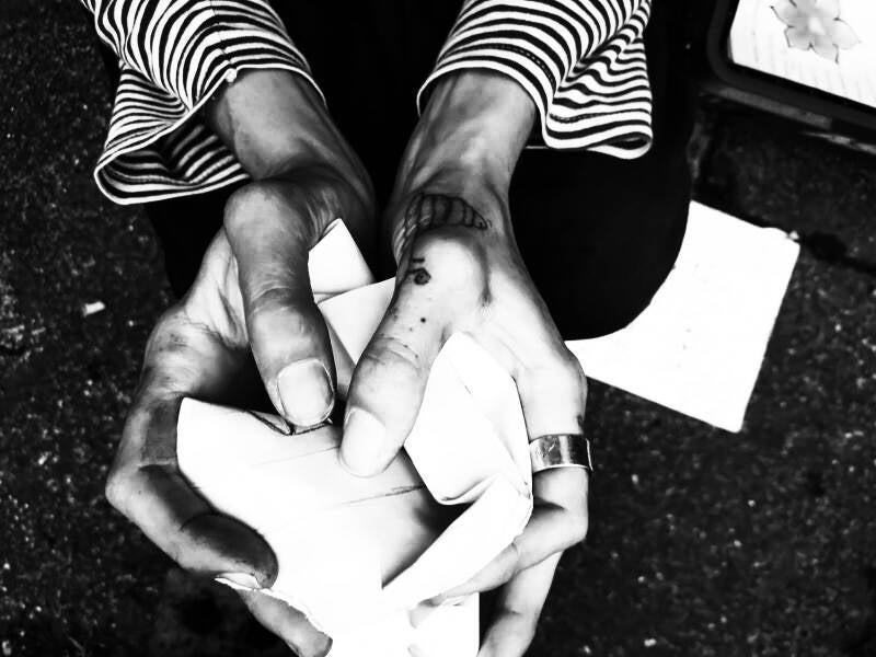 Hands crumple paper with care and love 
