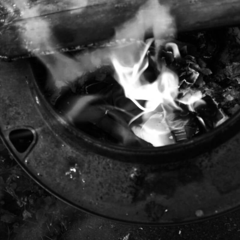 A poppet goes into the ceremonial fire 