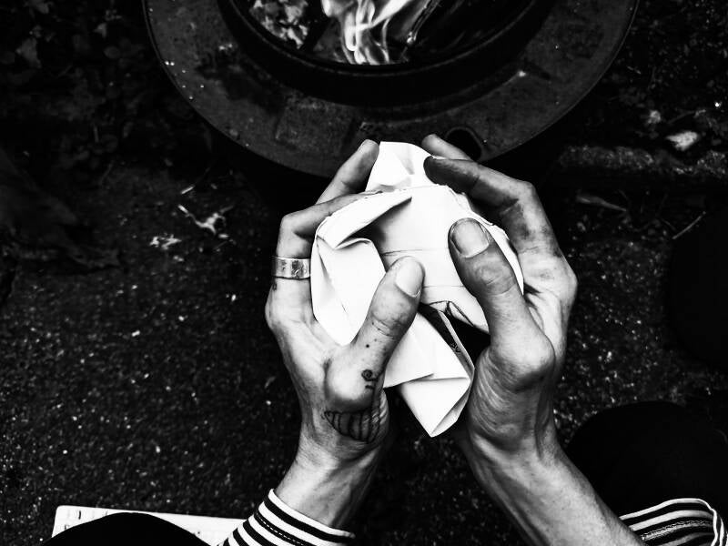Hands crumple paper 