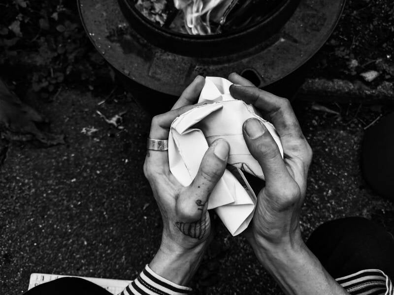 Hands crumple paper 