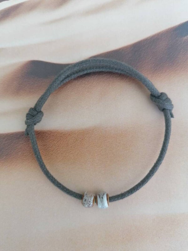 Koord armband met keramiek kralen