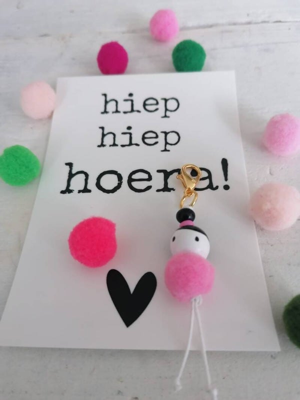 Gelukspoppetje met kaart