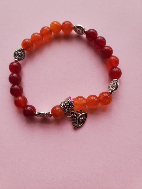 bracelet perles cornaline magnétisées breloque oeil