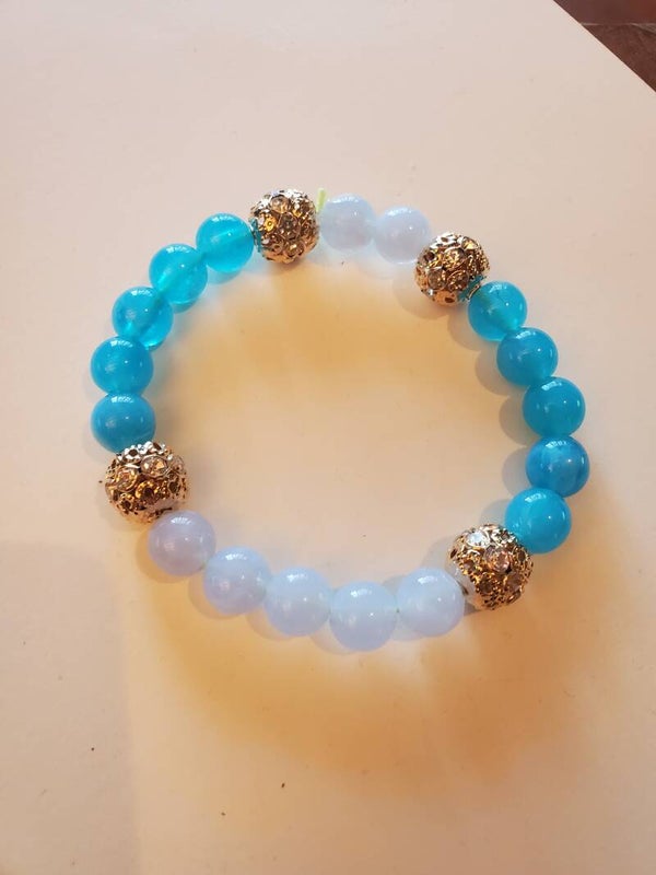 bracelet boule couleur or et perles précieuses azur et bleu clair magnétisé