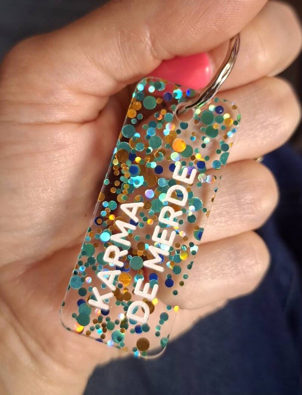 Porte clé paillette KARMA DE MERDE