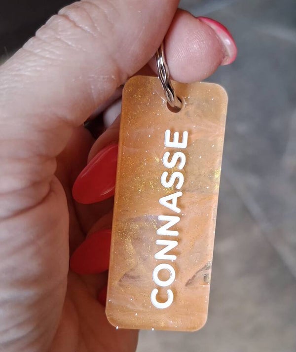 Porte clé paillette CONNASSE