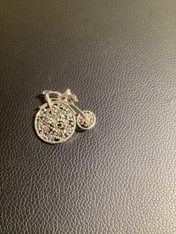 Whimsical Wonder: The Shimmery Circus Bike Pin