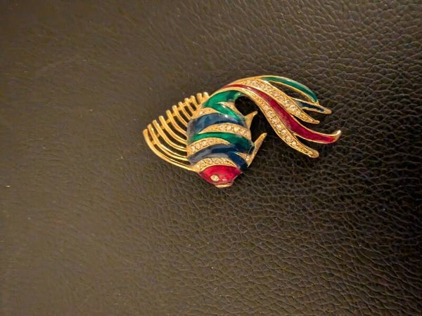 Whimsical Radiance: The Colorful Gold Fish Pin