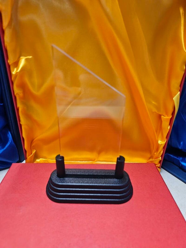 Small triangle pointed acrylic award with black base