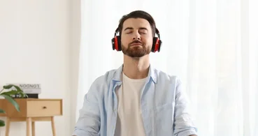 Man with headphone doing meditation