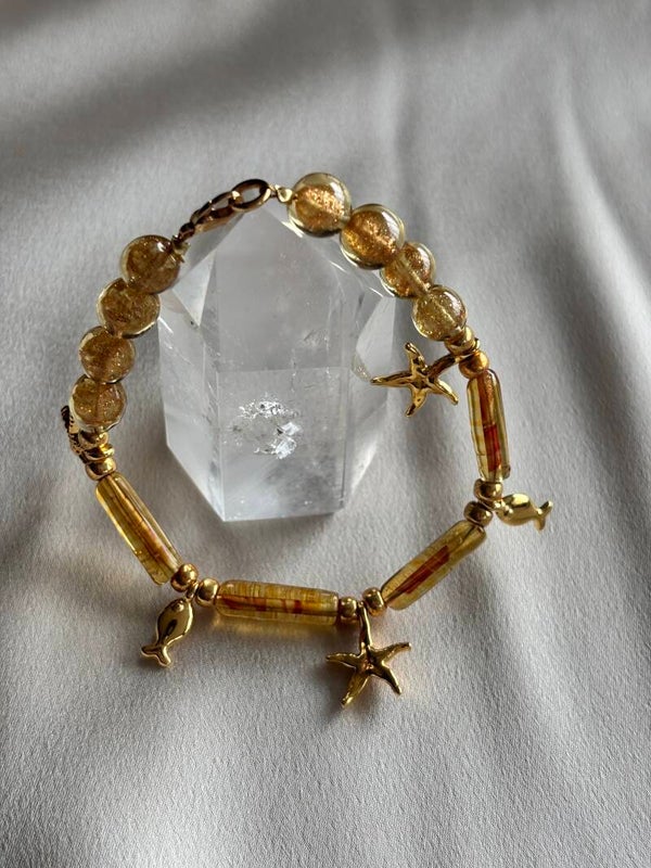 Murano glas armband met gouden bedels