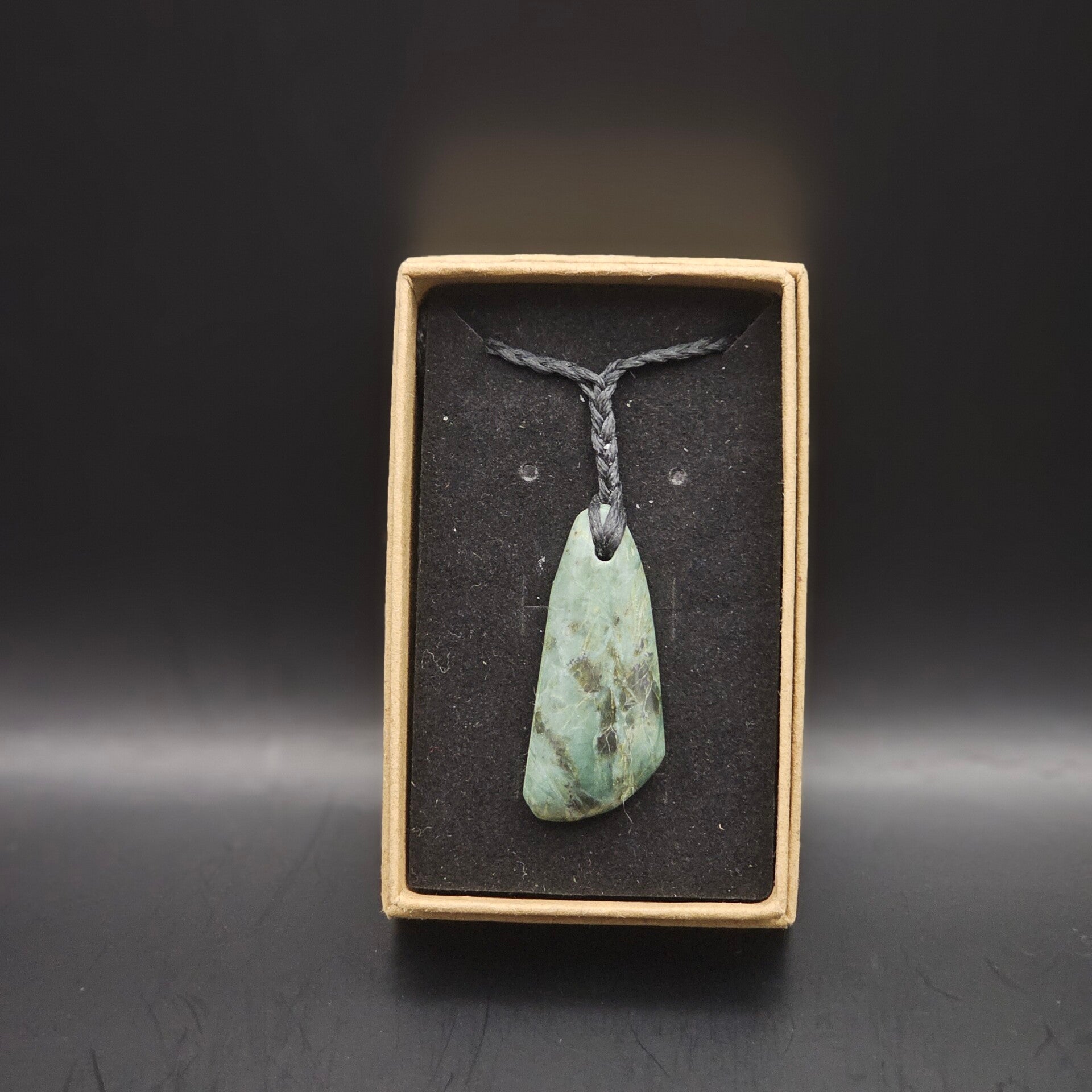 Small Tangawai Pounamu piece on braideed necklace