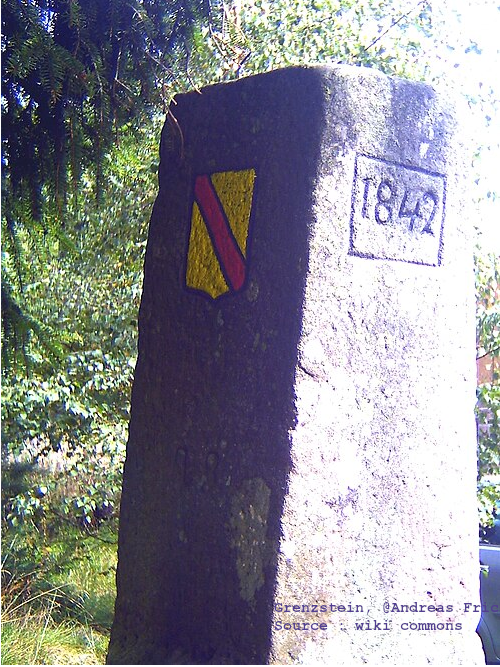 Historical 1842 border stone in the Schengen tri-border region of France, Luxembourg, and Germany