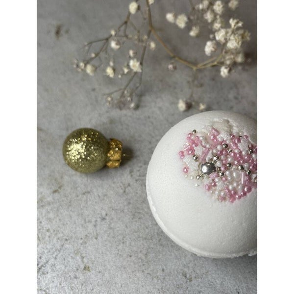 Kerstbadbal *roze magisch uur* Badbal met oranje/kaneelschuim